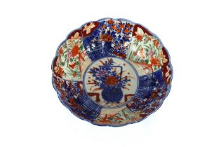 A Japanese Imari scalloped bordered fruit bowl, decorated in the traditional palette, 24cm