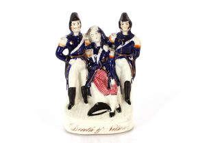 A rare mid-19th Century Staffordshire group, "Death of Nelson", 20cm high