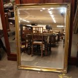 A large modern gilt framed bevel edged wall mirror, 133cm x 103cm