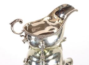 A George V silver sauce boat, having gadrooned border and fine acanthus C scroll decoration,