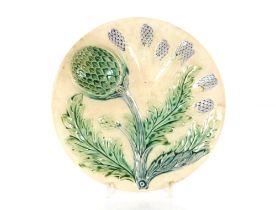 Ten Majolica ware hors d'oeuvres dishes with artichoke decoration; a Majolica ware asparagus stand