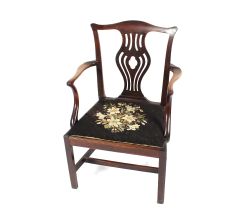 A 19th Century mahogany Chippendale design elbow or desk chair, with pierced splat back, upholstered