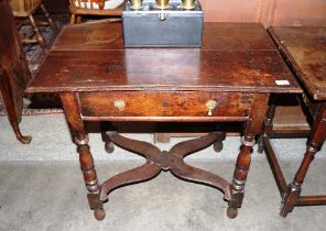 An 18th Century oak side table, fitted single long drawer and raised on baluster turned supports