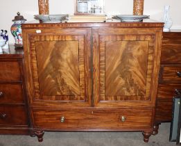 A 19th Century mahogany dwarf linen press, the interior sliding trays enclosed by a pair of ebony