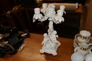 A Meissen blanc de chine four branch candelabra wi