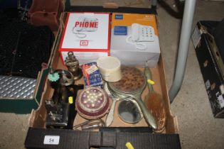 A box containing telephones, dressing table items,