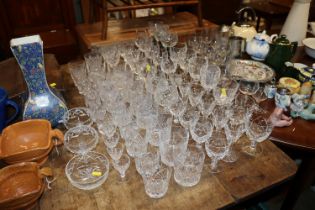 A large quantity of table glassware including wine