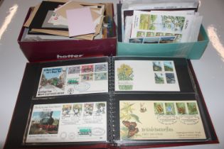 An album of First Day covers and two boxes contain