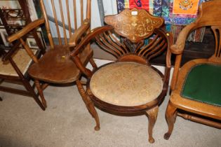 A 19th Century inlaid elbow chair, raised on cabri