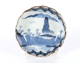 A Chinese blue and white shallow dish decorate wit