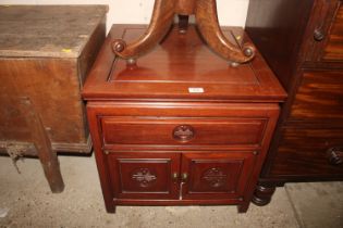 An Oriental hardwood side cupboard fitted single d