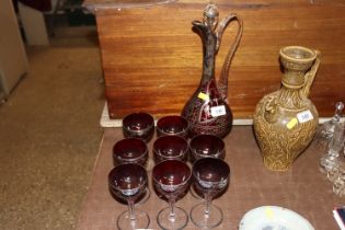 A silver overlaid glass liqueur decanter and glass