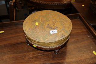 A mahogany and inlaid circular upholstered stool