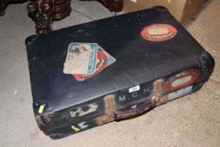 A vintage case with various labels