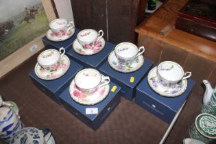 Six boxed Royal Kendall cups and saucers decorated