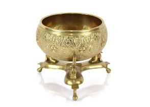 An Oriental brass bowl raised on elephant stand, 2