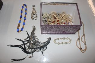 A box of costume jewellery, mainly necklaces