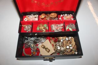 A cantilever jewellery box and contents of costume