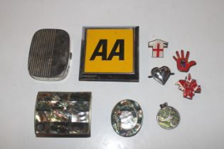 An AA badge; an abalone shell decorated box etc.