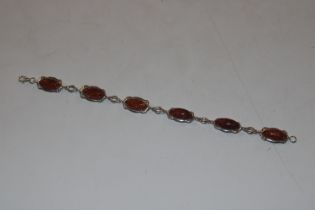 A Sterling silver and amber bracelet, approx. 10gm