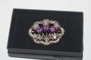 A Scottish Sterling silver and paste amethyst brooc