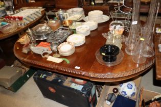 A heavily carved oak oval table