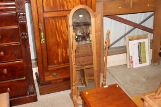 A pine framed wall mirror; and a pine cheval mirro