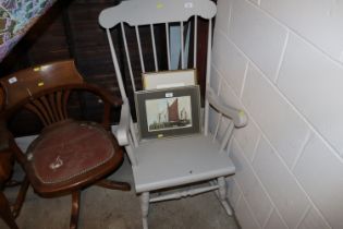 A painted stick back rocking chair