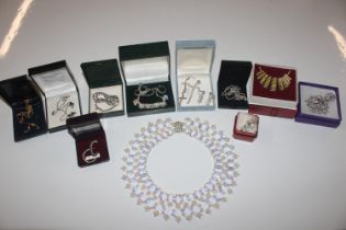 A box of assorted costume jewellery to include nec