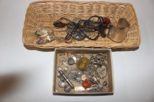 A basket and contents of various costume jewellery