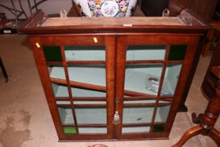 An oak and glazed glass fronted cabinet