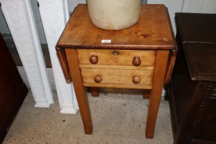 A Victorian walnut drop leaf side table fitted wit