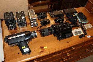 A collection of various cameras to include Yashica