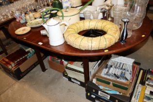 A reproduction mahogany extending dining table