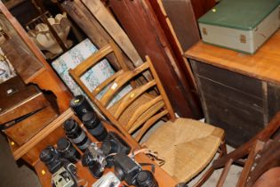 A rush seated ladder back chair, a cane seated bar