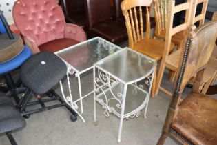 Two cast iron and glass topped tables