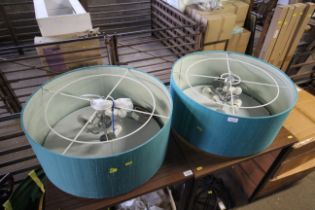 A pair of three bulb hanging ceiling lights with s
