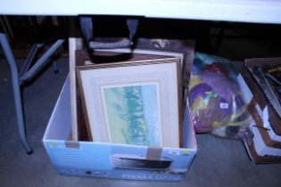 A box of various pictures and prints