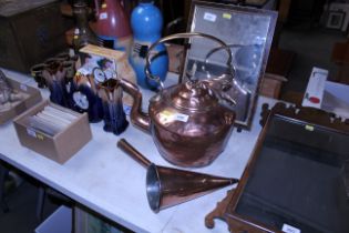 A copper kettle together with a copper grain measu