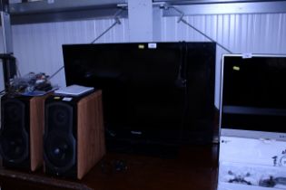 A Toshiba flat screen television lacking remote co