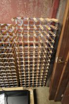 A large wooden and metal 96 bottle wine storage ra