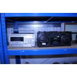 A Phillips stereo radio cassette recorder and a silver SR5000L cassette deck
