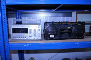 A Phillips stereo radio cassette recorder and a silver SR5000L cassette deck