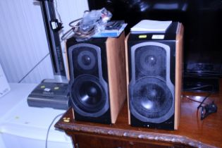 A pair of Edifier speakers and a remote control