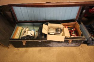 A large metal storage box and contents including a