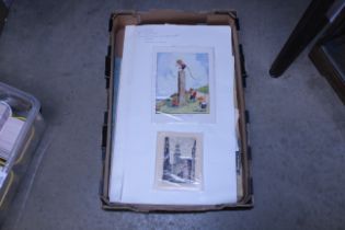 A box containing various prints