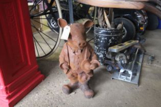 A cast iron statue in the form of 'Mr Pig' (55)