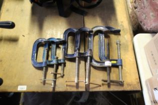 A pair of metal G-clamps and five various others t