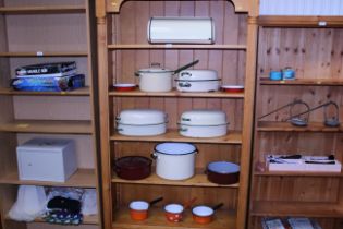 A quantity of enamelware to include saucepans, pot