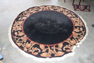 An approx. 7'8" circular patterned rug